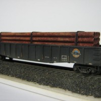 Very basic load install & minimal weathering to this MT gon. 
Hay Bros rusty pipe load > but I filed down the cast on banding cos IMHO it looked overscale. Then tied some elastic thread around the pipe load at the same place. 
BluTak holds this one in at the moment