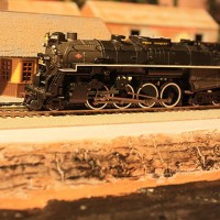 Pere Marquette 1225 alongside the depot and next to the lakebed.