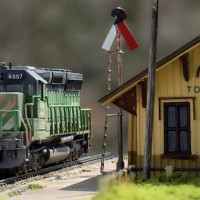 N scale Bachmann Spectrum SD45 and scratchbuilt depot. The Bachmann diesel sits a bit high off the rails, but is otherwise a nice model. The depot is mostly Evergreen styrene, with windows from a Walthers kit.