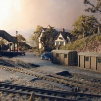 Looking across to the pub on my British layout. New SR style concrete huts.