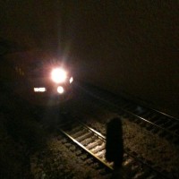 Kato F unit takes siding at night.