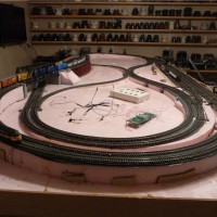 This is one of two test bed layouts. I verified I could control a large layout via the computer and I developed block detection and signal circuitry. The layout suffers from poor alignment and excessive grades.