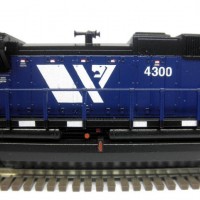 Kato SD70ACe MRL 4300.  Used Model Masters acryl "Blue Angel Blue". Used Trainworx SD70ACe/M-2 detail set and BLMA grab irons.  Moved Headlight to the nose, shaved off number board backing to make more correct, removed smaller GPS dome and lowered rear headlight.  Rear of underframe was milled to make rear grills see-through.