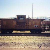 A Rio Grande bay window caboose rests in Fremont, Ca. on the SP.