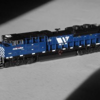 Kato SD70ACe MRL 4300.  Used Model Masters acryl "Blue Angel Blue". Used Trainworx SD70ACe/M-2 detail set and BLMA grab irons.  Moved Headlight to the nose, shaved off number board backing to make more correct, removed smaller GPS dome and lowered rear headlight.  Rear of underframe was milled to make rear grills see-through.