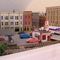 The eastern town of Pineville with its older buildings, fast food, and older station.