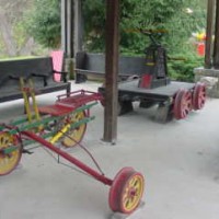 The ES&NA RR (3 wheels rail cart), This is one of many displays in The ES&NA RR Yard. 
In back is another display, it is an two man Hand Pump Railroad Maintence Cart.