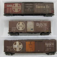 3 x Micro Trains ATSF Boxcars I just got done with some generic weathering. No real mods cept I painted the tack boards / scrapped the roof walk from #6153