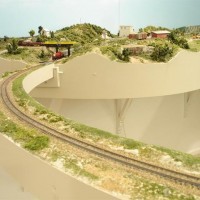 Close up of removable bridge.  Note the side banks to keep the cars on the track if bumped.