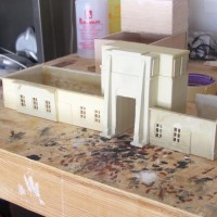 Here is the model thus far. The tunnel mouth takes about 22oz. of resin to pour & is sollid resin. The walls took 6 seperate RTV molds not to mention the seperate mold to build my own windows. I will soon upload new pics showing the exterior of the tunnel, rear venting towers along with the rear of the main portal. Some of my features are a tad off but it should still look impresive when done.