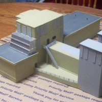 Rear side view. I used the flowquil aged concrete paint, reefer gray for the roof, testers silver for the side roof vent & dark brown for the windows & 2 doors. It is really taking on its shape at this point.