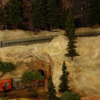 The El Capitan enters the High Sierra tunnel, while a freight passes below