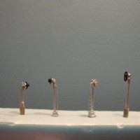 Inexpensive (FUNCTIONING) signals for the thrifty minded modeler using red/green bi-polars.  The design is flexible, but it is for the "non rivet counter" modelers.  The shorter signals are used at a distance for perspective.  I did the 26 signals on my layout for under $2 each.