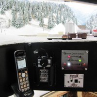 Farron summit train order station showing train order panel and phone to Dispatcher (and Digitrax radio throttle).  

An Eastbound has the Board set against it but it looks like the crew have already picked up their orders and pressed the "acknowledge button" to let the Dispatcher know that the order has been properly received and understood.