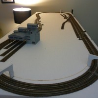 All track is laid! Hurrah! To boot, all switch throws are installed, and every frog has a feeder wire to the underside