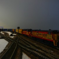 A Through Freight rolls through the (yet to be named) town, heading towards the (also yet to be named and modeled) river