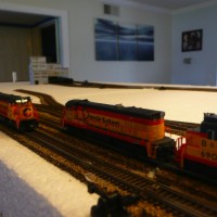 With the freight rolling through, the local has to wait to cross the main to continue it's switching duties around town