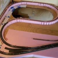 This is in the corner to the left of the main yard module.  I will be able to turn trains around in this area.  The two turnouts lower left will continue on to an oval helix.