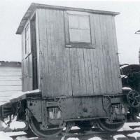 Oregon-American single-truck caboose.