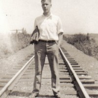 My Grandpa as a teenager, probably about the time he was riding freights. Yes, I know riding freights is deadly dangerous, as is posing in the middle of a track. This was his more unruly, youthful phase before he became a rules-oriented, safety-conscious railroad conductor.