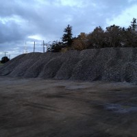 A REALLY big pile of ballast. Normally, this is where we would park our trucks. I wonder if N scale people see our piles of ballast like this?