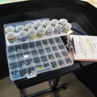 The tags for destinations are below sorted by town.  The cups above are for Nelson and staging destinations and are removable...if an industry calls for 4 XMs , just dump it in the Nelson cup.  When you get to Nelson parcel them out.  If there is more tag demand than Nelson can fill, "requisition" more cars from Cranbrook by dumping the balance from the Nelson cup into the Cranbrook cup...then proceed to Cranbrook, etc.