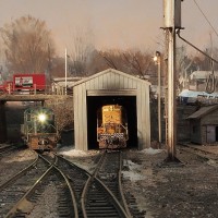 RS-2 enters the yard while the RS-11 sits in the shed.