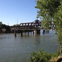 An Amtrak Capitol Corridor train crosses the river in downtown Sacramento.