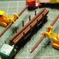 Two of Jon Pope's Heavy Equipment done at Shapeways Cat 955 with grapples "Z" scale and one of stony's Cabover Semi Truck assemble by me and painted