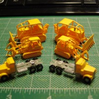 shapeways made by Jon Pope Two Cat D-8 w/winch back then two Catt 955 w/grapples and to of Stonysmith's Semi trucks. assemble by me and painted