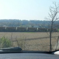 EX UP boxcars sitting at the end of the line, in the middle of a field, near nothing railroad related.