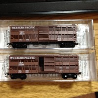 Two new N scale Micro-Trains Western Pacific stock cars.