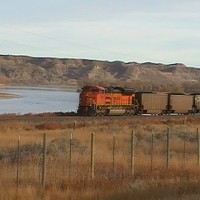 BNSF 9311 dp PIC 1710. Yellowstone curve in background of coal load eastbound west of Terry, MT.
