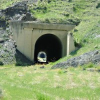 Looking west thru Tunnels 5 and 6,a nd over Belt Creek Trestle in between
