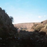 Cut in the hill just to the East of the Trestle.