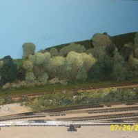 Power Plant settling pond w/ View Blocking treesHiding 2 staging tracks