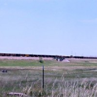 A complete Rawhide (RAWX) train south of Cheyenne, approaching the C&S