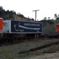 Marine Corps trailer on EB BNSF pig train, Woodford CA Jan 03