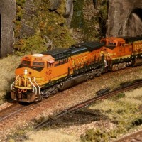 BNSF GEs exit the tunnel under the big curve-BNSF Ella Taylor Sub
