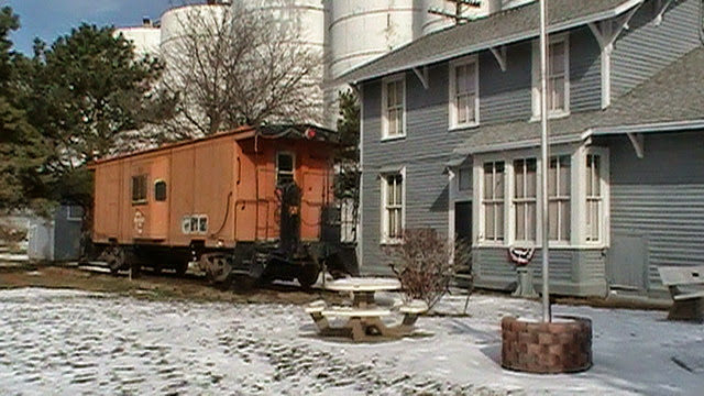 Hornick, IA PIC 1736. Milw caboose and depot.